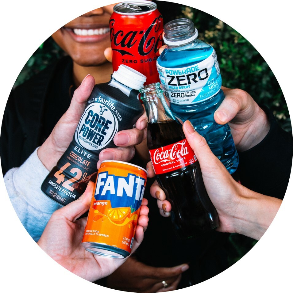A group of people enjoying Coca Cola, Powerade Zero, Fanta and Core Power